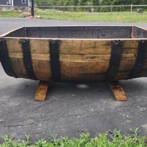 Refinished whiskey barrel planter - cut lengthwise